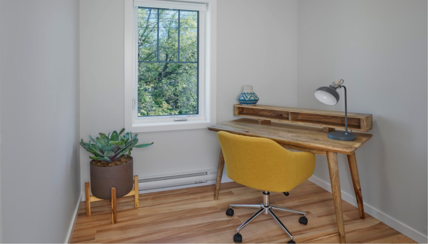 Desk and chair in office in Littlehorn Garden Suite by Effect Home Builders in Edmonton